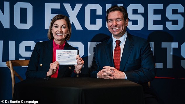 Iowa Governor Kim Reynolds signs her caucus commitment for the Ron DeSantis ticket in exclusive photos obtained by DailyMail.com