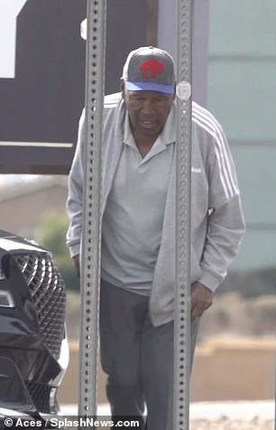 Simpson was dressed in a gray polo shirt and a matching track jacket and sweatpants