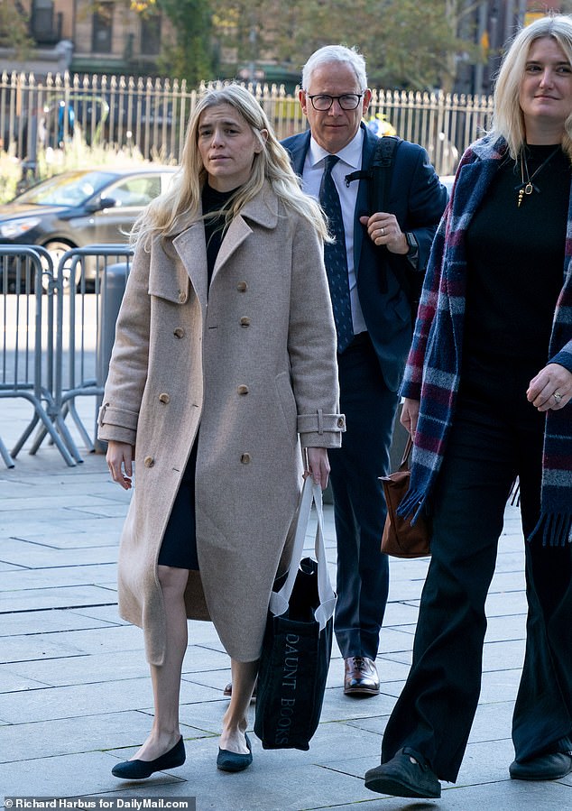 Graham Chase Robinson arrives in Manhattan federal court on Monday.  Before the jurors were seated, her lawyer told the court that she had received an abusive text message shortly before the hearing began – and suggested it may have been sent by one of her former employer Robert De Niro's children.