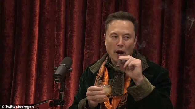 Elon Musk appeared on Joe Rogan's podcast Tuesday, smoking a cigar and drinking what appeared to be whiskey