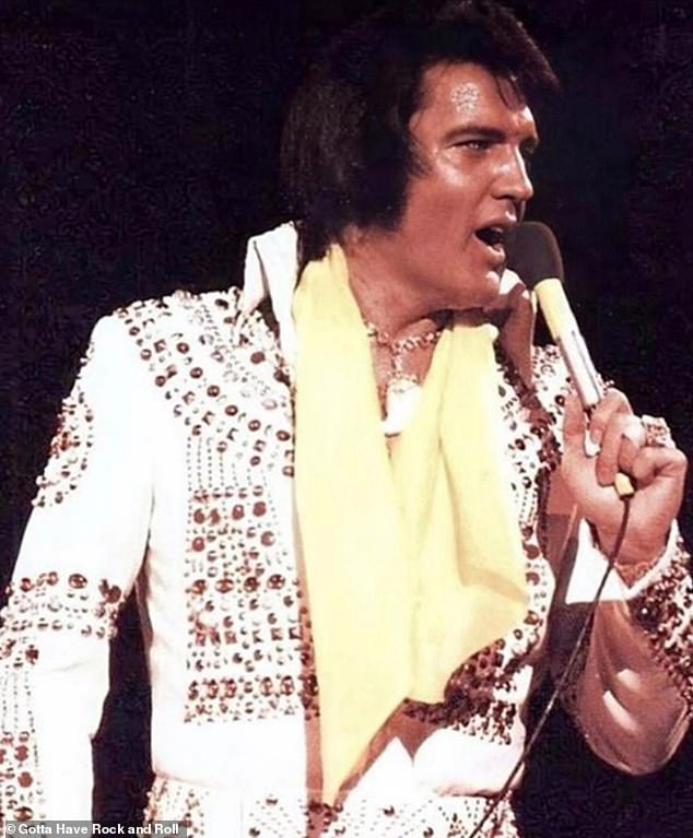 Bling: The legendary lion claw necklace worn by Elvis Presley will appear at auction;  pictured 1975