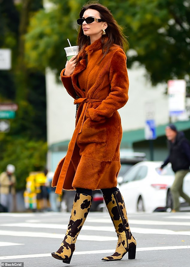 Kicks: Emily Ratajkowski had legs for days in leopard-print stiletto boots as she zipped around New York City on Thursday