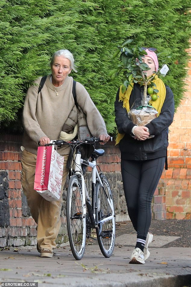 Family: Dame Emma Thompson, 63, enjoyed a day of shopping in Hampstead with her daughter Gaia Wise, 24, who struggled to carry a lemon plant on Saturday