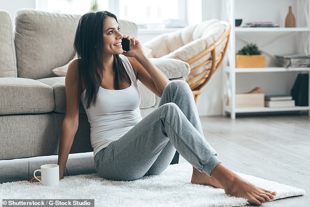 When on the phone, make sure you concentrate on the conversation and never make the call on busy public transport, when walking down a busy street or while doing housework (stock image)