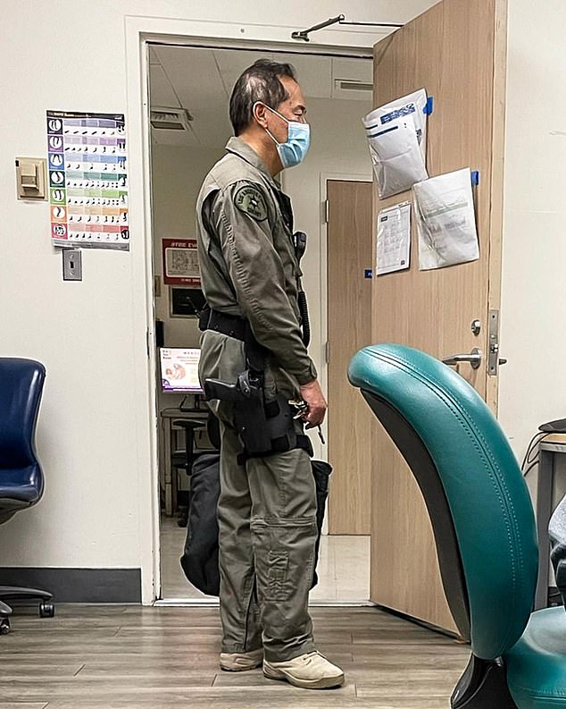 Dr.  Louis Kwong, former chief of orthopedics at Harbor-UCLA Medical Center, pictured with a gun on his hip in his operating room