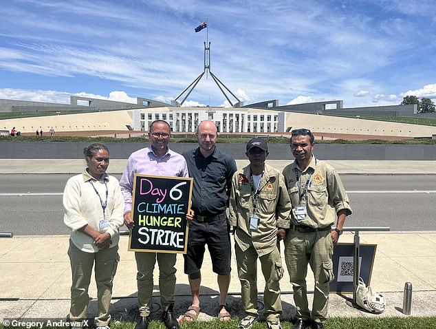 Mr Andrews said he lost 4.5kg in the first six days of the protest (Mr Andrews pictured with Associate Professor of Biology at ANU Benjamin Schwessinger with delegates from East Timor)