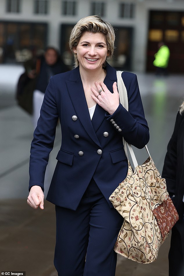 Stylish: Jodie Whittaker, 41, looked chic in a navy blue suit as she headed to BBC Studios on Thursday to celebrate the 60th anniversary of Doctor Who