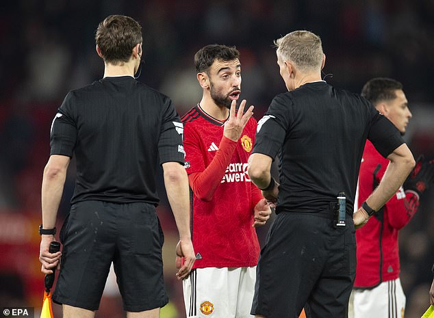 Manchester United captain Bruno Fernandes complains to the referee after playing Luton