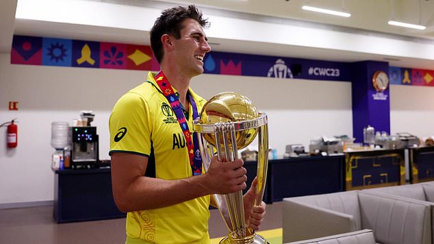 Cummins (pictured celebrating World Cup victory in Australia's dressing room) was 'almost flawless' during the World Cup, according to Ricky Ponting