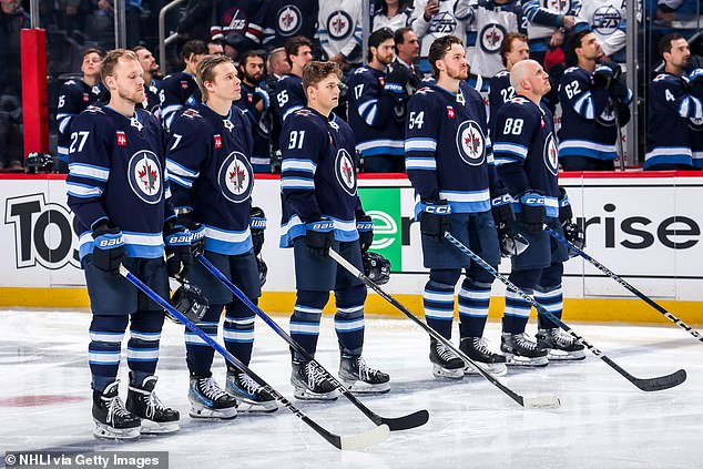 Nikolaj Ehlers #27, Vladislav Namestnikov #7, Cole Perfetti #91, Dylan Samberg #54 and Nate Schmidt #88 of the Winnipeg Jets appear for a recent game.  Ehlers, Namestnikov and Perfetti all experiment with neck protectors during practice