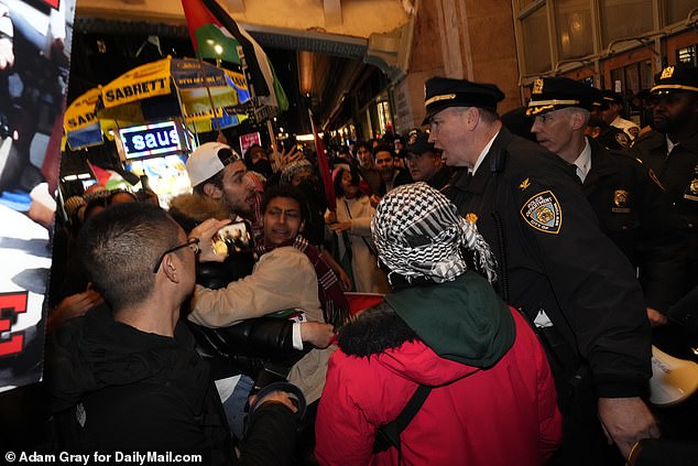 NYPD officers confront some protesters outside Grand Central Station