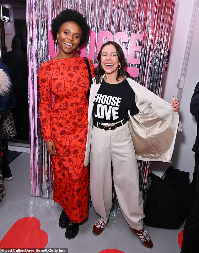 All smiles: Bel looked in good spirits as she beamed in a cream two-piece suit, showing off her T-shirt as she posed alongside actress Aliyah Odoffin