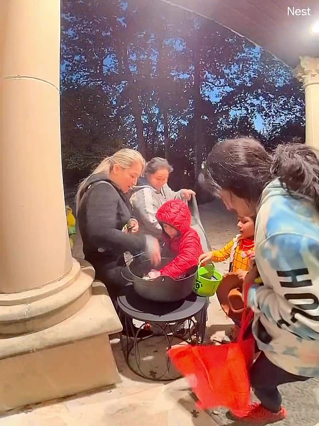 A group of nine, including three adult women, were caught on camera finishing a huge bowl of candy outside musician Cody Tate's home.