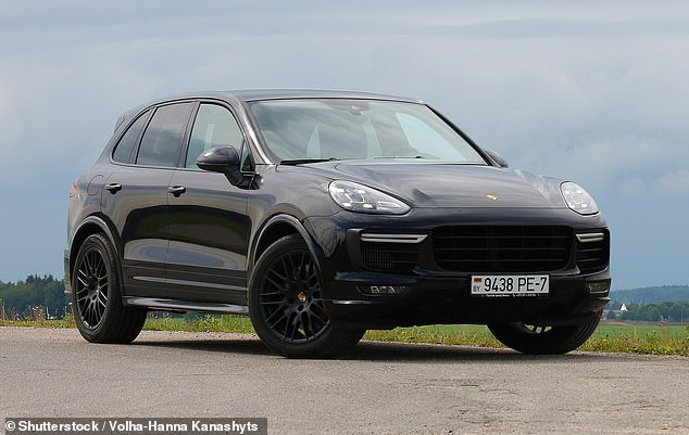 Police are now looking for four people spotted at the scene in a black Porsche Cayenne (as above).