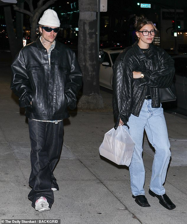 Stylish duo: Hailey Bieber, 27, showed off her sense of style as she teamed up with husband Justin Bieber, 29, in a leather jacket for a low-key date night in Los Angeles on Sunday