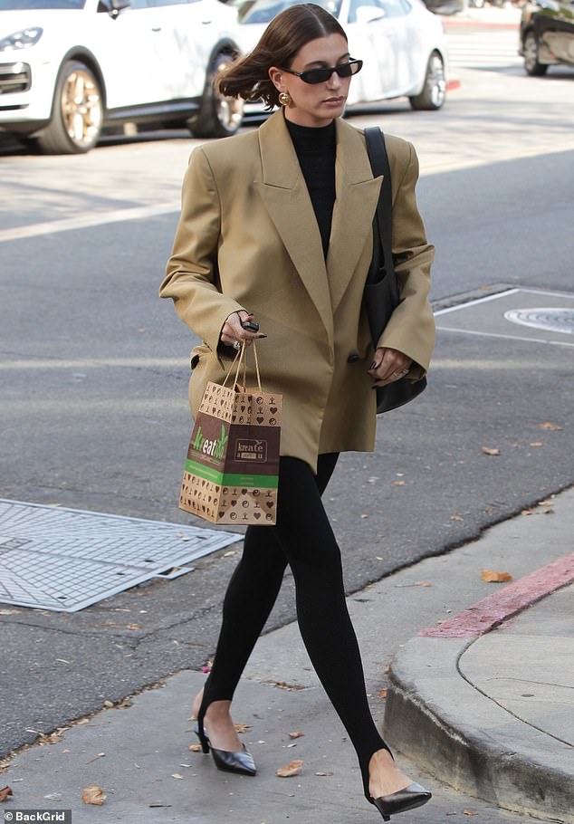 Here she goes: Hailey Bieber oozed business chic as she was spotted walking around Los Angeles on a sunny November day this week