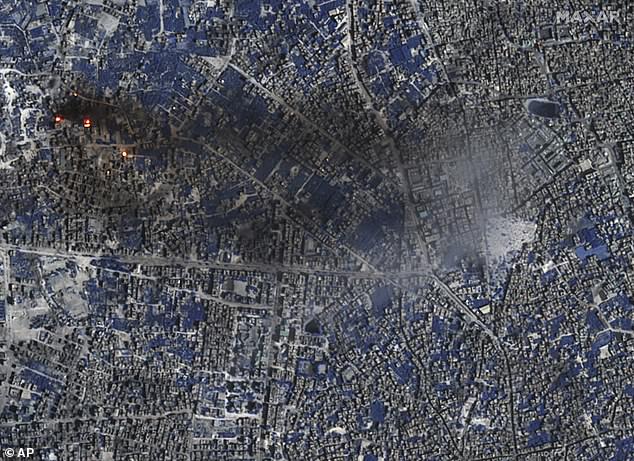 This image from Maxar Technologies shows a close-up shortwave infrared view of some burning buildings and active fires in Gaza City, November 7