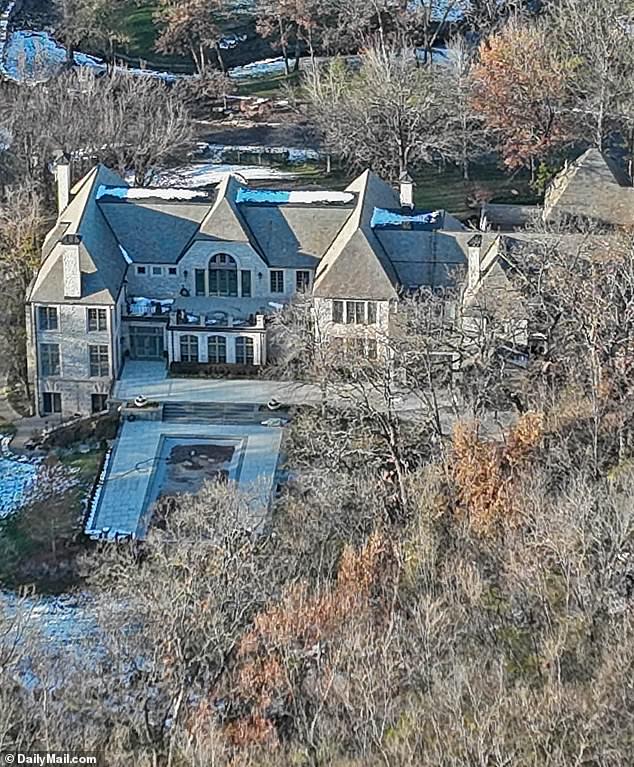 Travis' new home has a Beverly Hills-style pool and Jacuzzi, a six-car garage, a lighted tennis and pickleball court, and a miniature golf course, all spread across three acres of heavily wooded, pristine land.