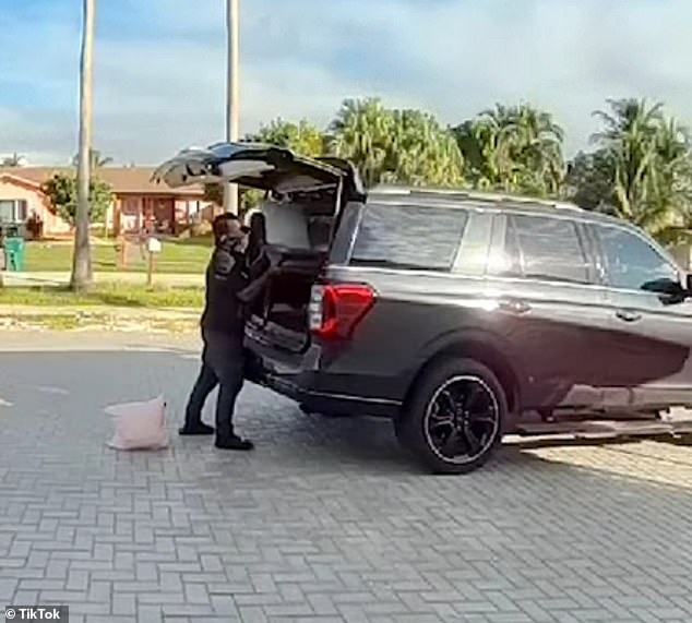 Bizarre surveillance camera footage shows the moment a masked thief stole a wicker chair from a Miami home and struggled to fit it into the trunk of his car