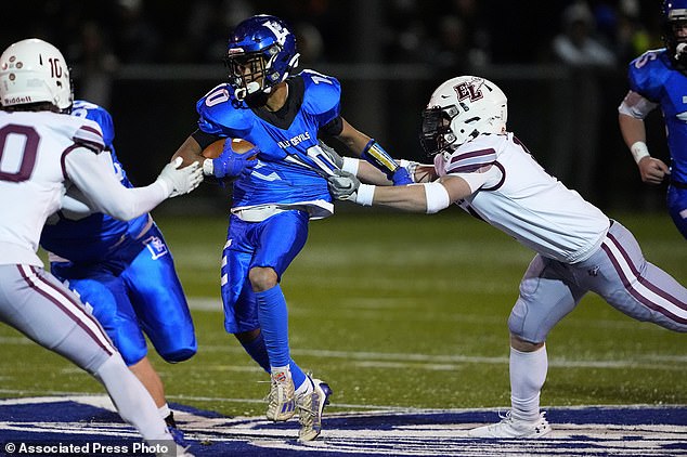 Lewiston High School running back Jayden Sands runs toward the end zone with the football