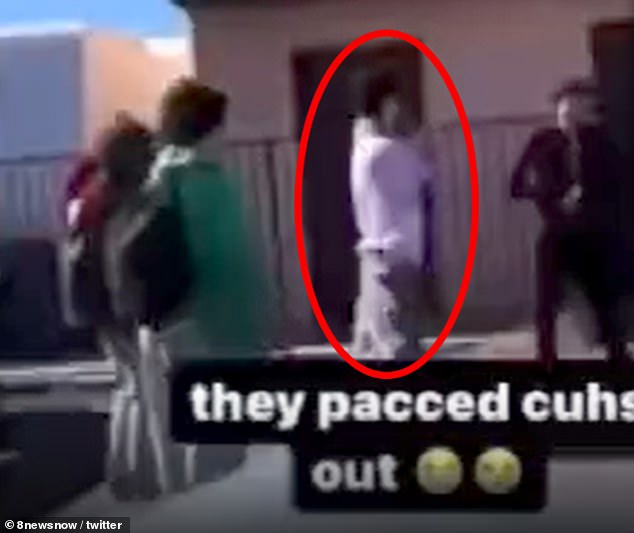 Jonathan Lewis, circled, is seen moments before punching another teen