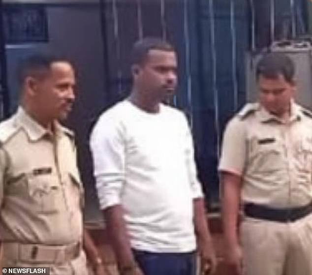 The 25-year-old man, identified as K Ganesh Patra (center in photo), had a marital dispute with his wife K Basanti Patra, 23