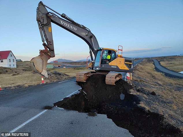 Roads near Grindavik have been completely torn up due to the volcanic activity.  Today an excavator was seen making repairs