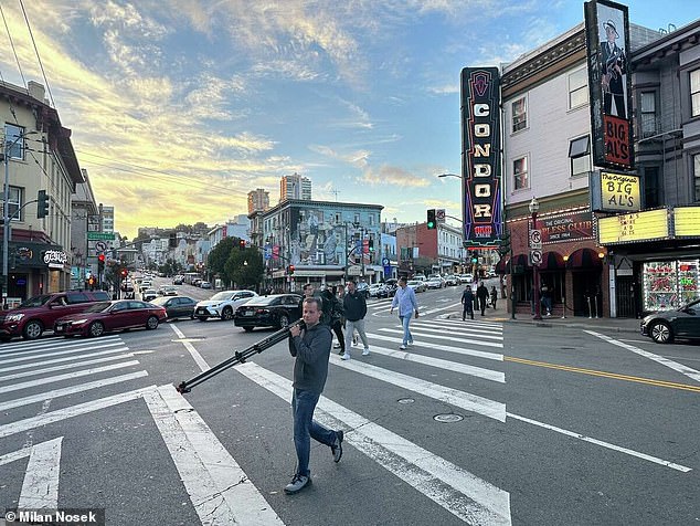 Milan Nosek, a journalist from the Czech Republic, carries a camera on Columbus Avenue in San Francisco's North Beach neighborhood.  Nosek and the team of television journalists he was with were robbed of their camera and other equipment nearby while covering the APEC summit