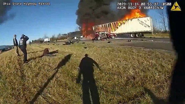 Police bodycam footage shows the highway patrol officer responding to reports of a fatal collision on Nov. 14 that resulted in a four-way car crash and a fire on I-70