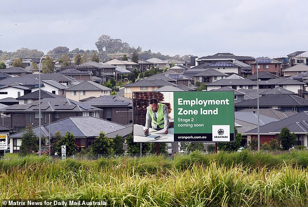 Borrowers in an Australian state will soon be paying typically almost $60,000 a year on their mortgage repayments after the Reserve Bank's latest rate hike (pictured are homes in Oran Park in Sydney's far south west)