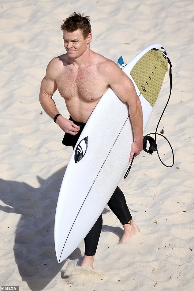 Channel 10 sports presenter Scott Mackinnon bared his sculpted torso on Tamarama beach.  Pictured