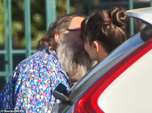 Aww: The couple shared a sweet kiss before getting into their car and heading to lunch in the Los Feliz neighborhood