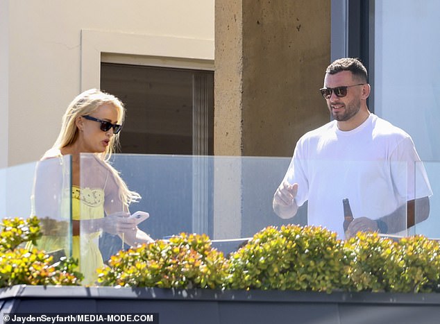 Jackie 'O' Henderson has opened up about her online dating habits.  Pictured last week with a mystery man on her balcony