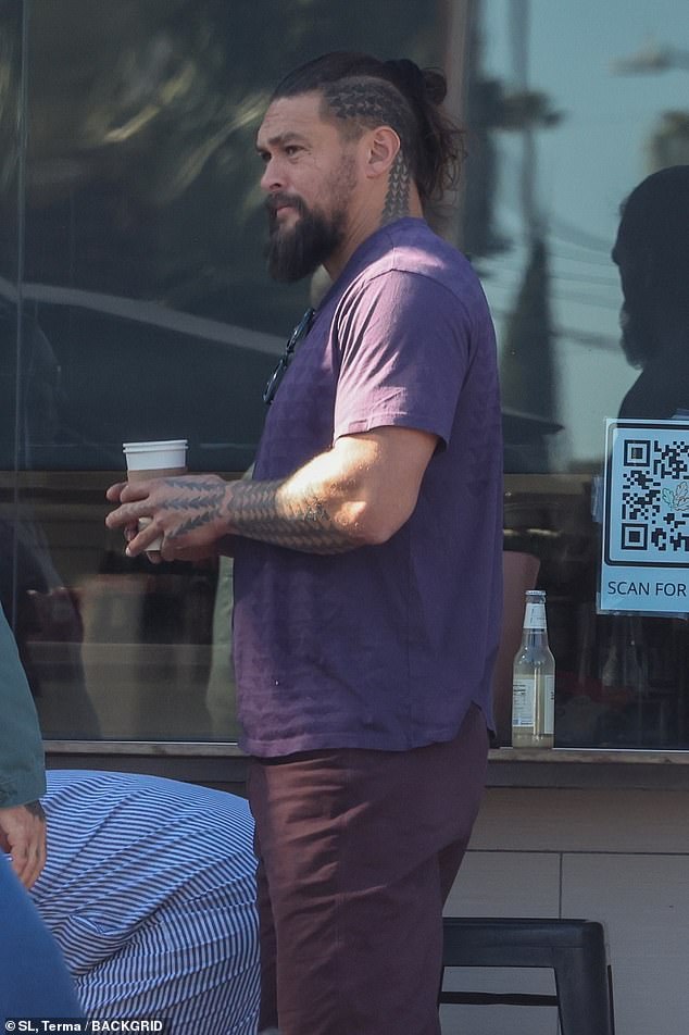 Coffee break: The Aquaman star enjoyed a cup of coffee while enjoying the fresh air and sunshine with his friend