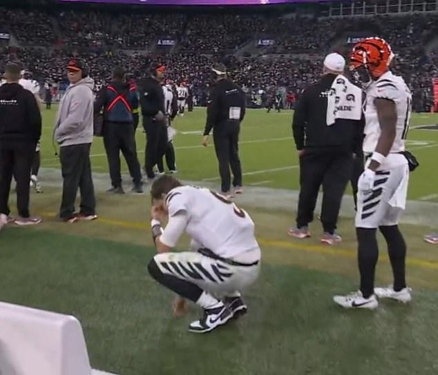 After trying to throw on the sideline, Burrow shook his head no and ran to the locker room