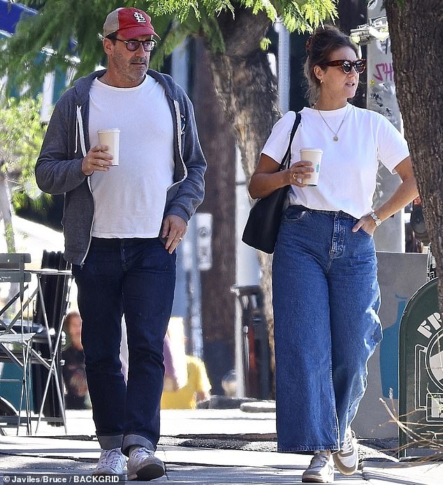 Casual attire: Hamm also wore dark blue cuffed jeans contrasted with white sneakers