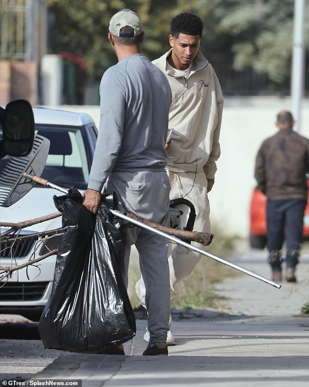 He wore a full tracksuit from designer clothing outlet Rhude as he went about his business