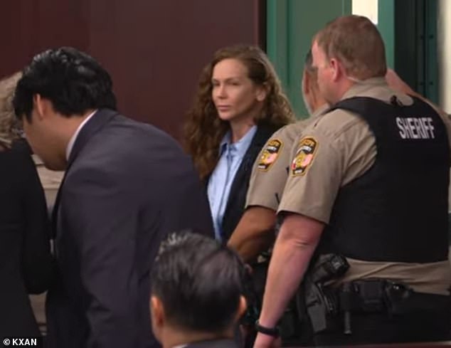 Yoga teacher Kaitlin Armstrong enters the courtroom Wednesday for opening statements in her murder trial