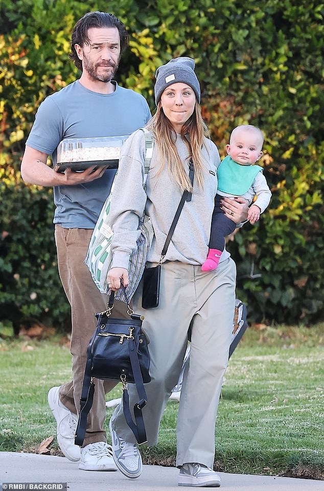 Happy: Kaley Cuoco looked cheerful as she smiled while holding her adorable baby girl Matilda on her hip in California on Wednesday