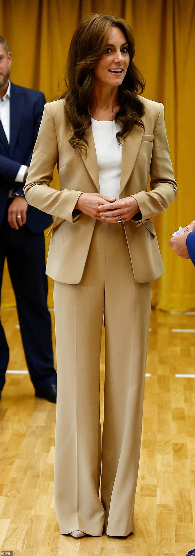 Kate Middleton stunned in a camel suit as she visited a charity in East London on September 19