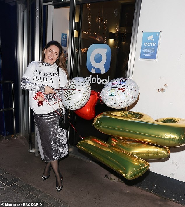 Rogue: The brunette beauty initially left the studios wearing a graphic white T-shirt with the caption 'my dad had a Skoda', with several balloons with her initials on them