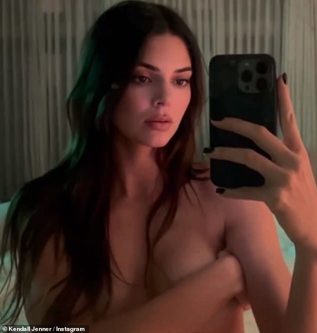 Kendall Jenner, 28, put on a sexy display on Wednesday as she posed topless on Instagram in a very racy video