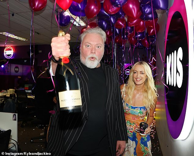 Kyle Sandilands and Jackie 'O' Henderson popped the champagne and celebrated with their team on Wednesday after signing a record $200 million, 10-year contract with KIIS FM