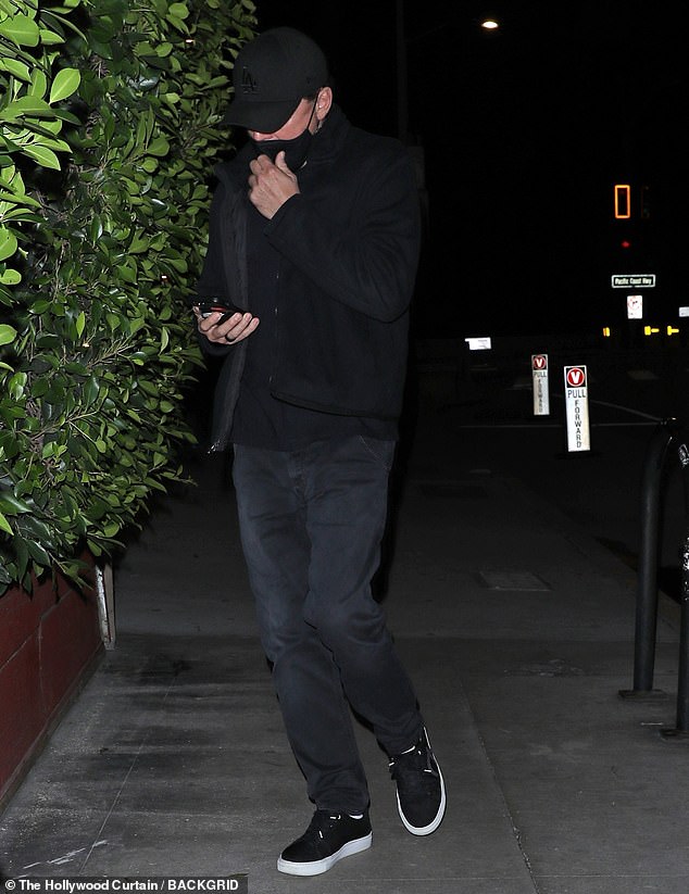 Unrecognizable: Leonardo DiCaprio was almost unrecognizable when he arrived at Giorgio Baldi Italian restaurant in Santa Monica on Friday evening for an early 49th birthday celebration with friends