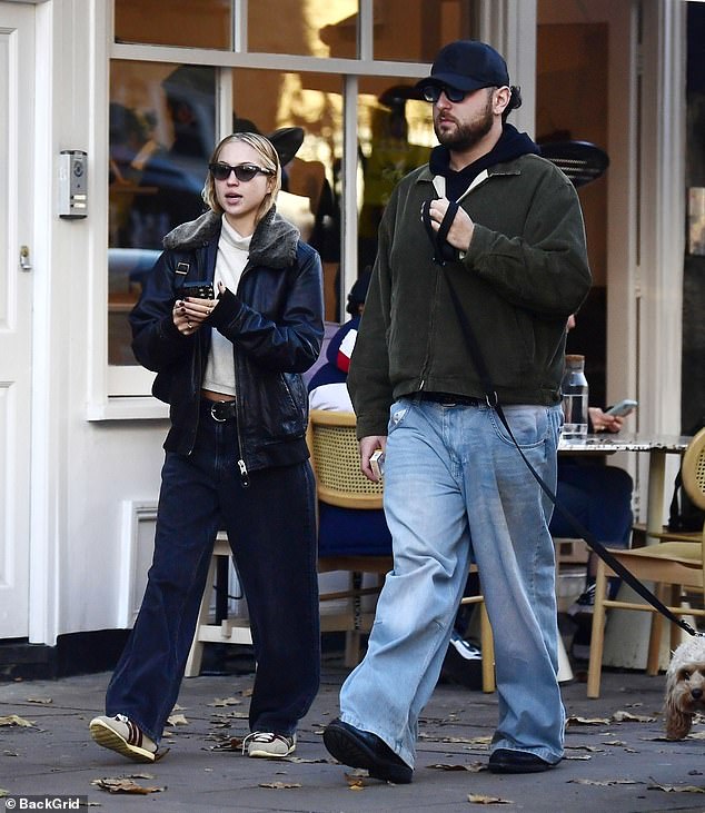 Out and about: Lila Moss, 21, looked stylish as she took a peaceful dog walk with her male friend in London on Thursday