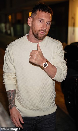 Lionel Messi gives a thumbs up during a night out