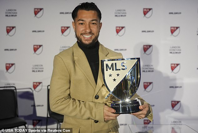 Luciano Acosta holds up the MLS MVP trophy after being voted the league's best in 2023