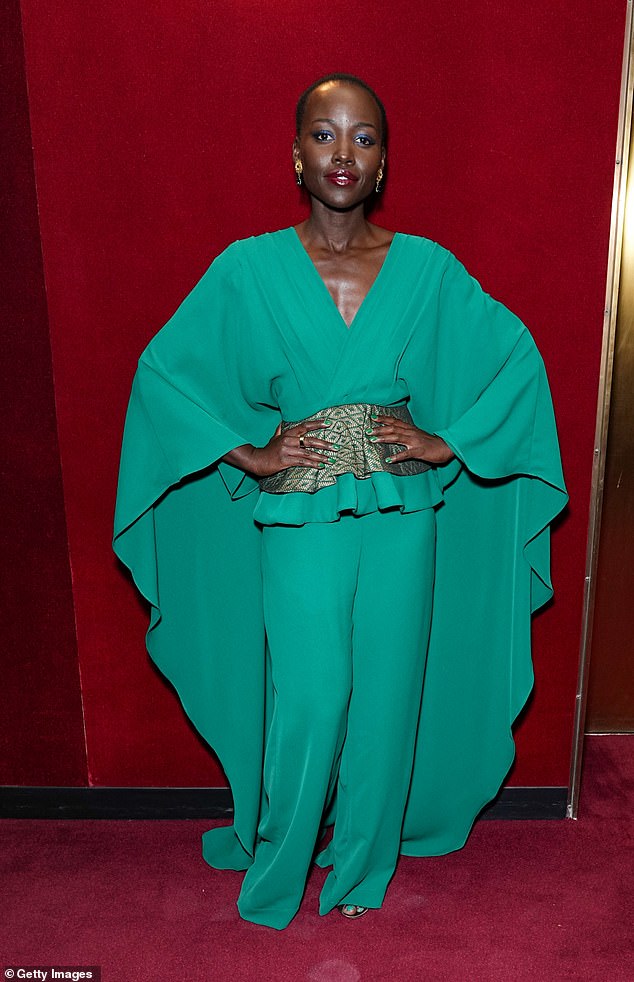 Wow!  Lupita Nyong'o, 40, turned heads in a striking green ensemble as she attended the opening night of X: The Life And Times Of Malcolm X at the Metropolitan Opera in New York on Friday