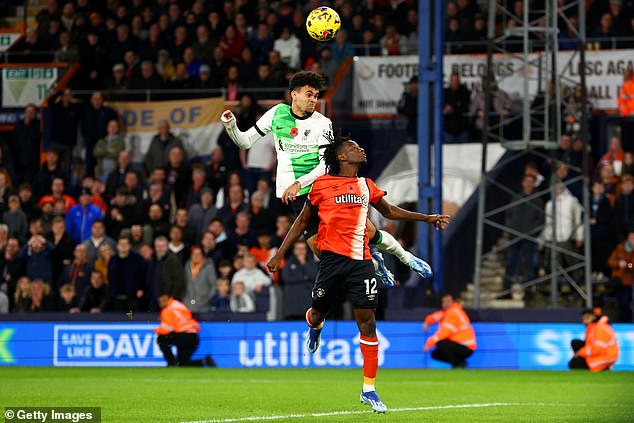 Luis Diaz (left) came off the bench to rescue a draw for Liverpool after rising highest at the back post in stoppage time