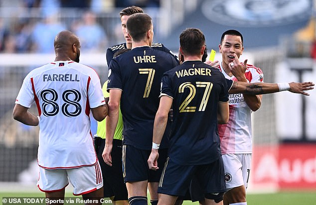 Kai Wagner (second right) allegedly made a racist comment to Bobby Wood (right) during their match last Saturday.  The players are pictured above during an earlier incident during the game